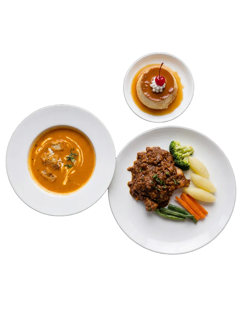 Curry platter with three different regional curries arranged on a single plate