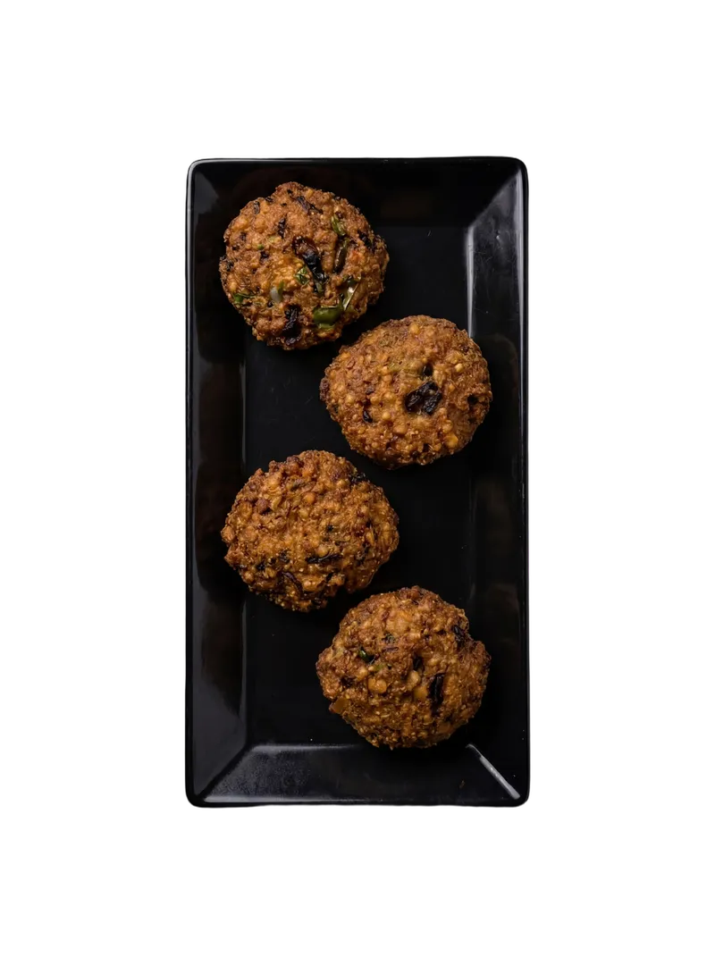 Dal vada — fried chana dal fritters with curry leaves and green chili