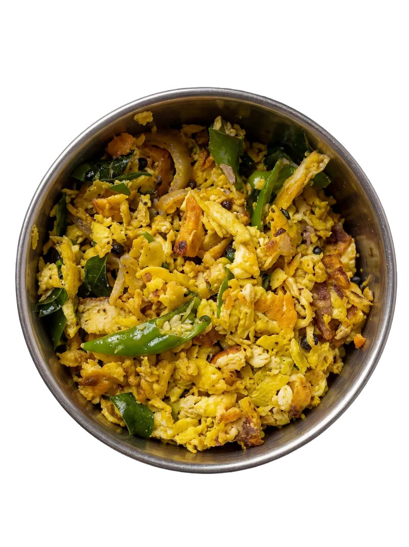 Mumbai-style egg bhurji with onions, tomatoes, and green chillies on a white plate