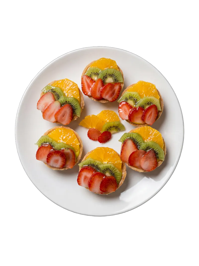 Six mini fruit tarts with kiwi, strawberry, and citrus arranged in a hexagonal cluster