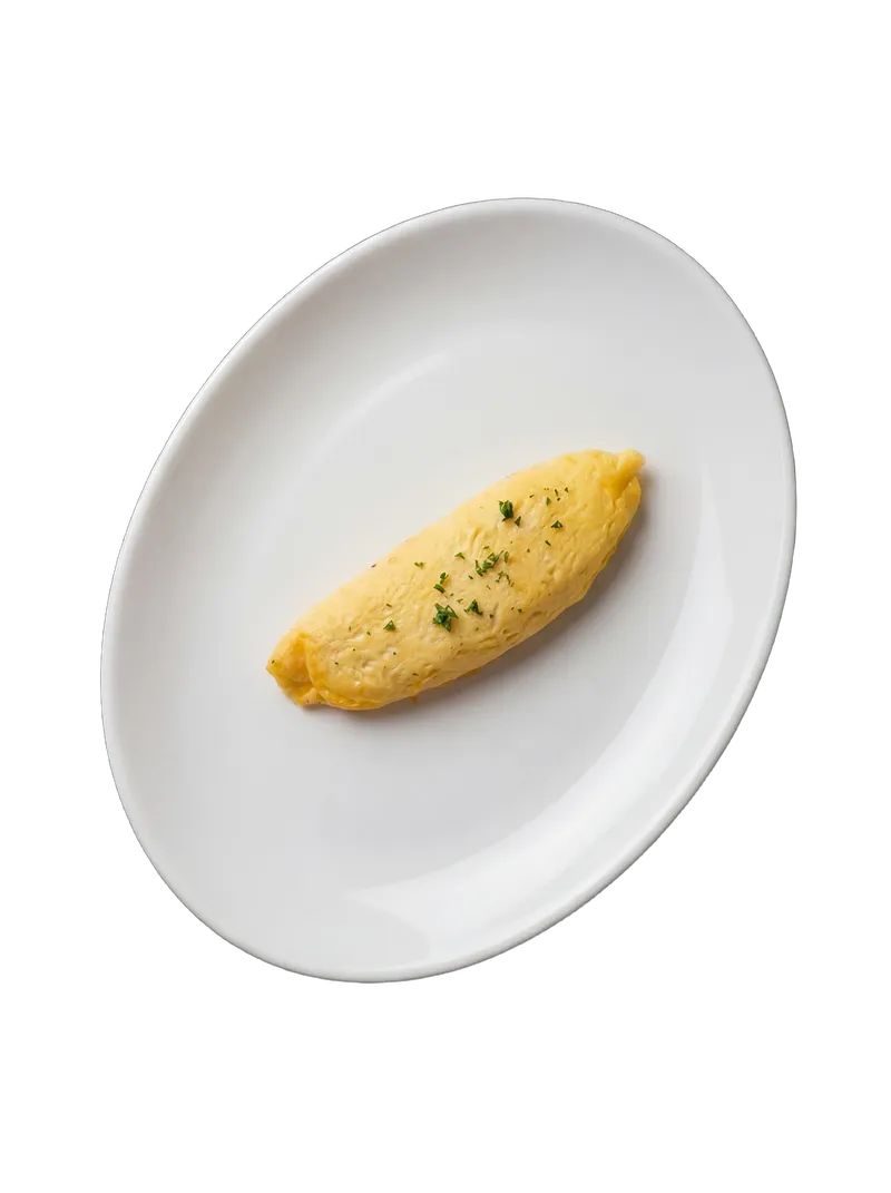 Classic French-style folded omelette with herbs on a white plate