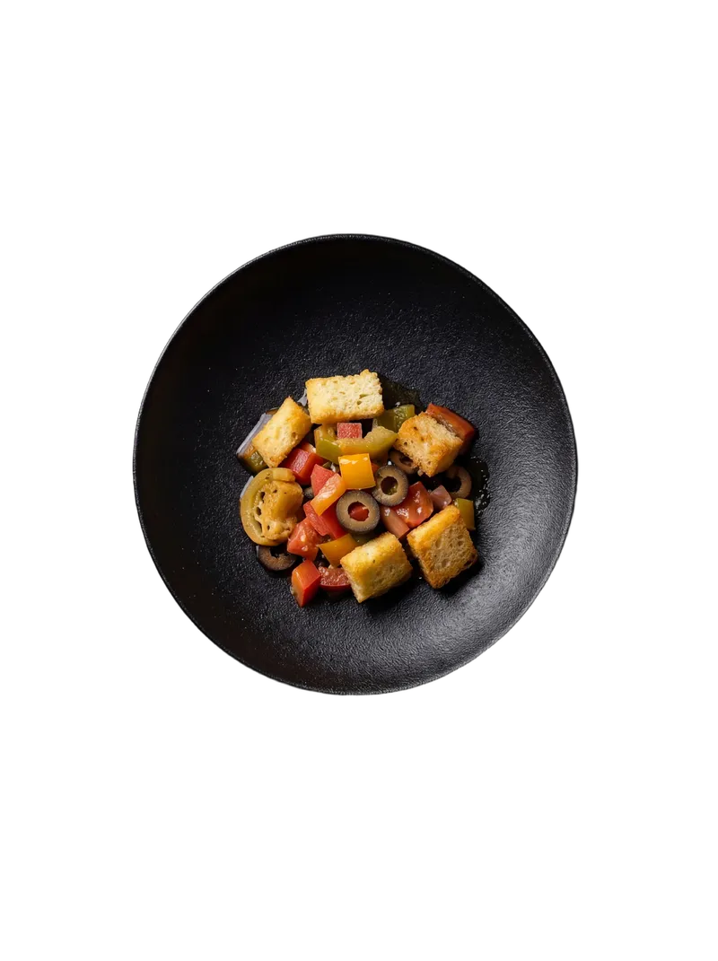 Paneer tikka cubes charred at the edges with bell peppers and onions on a white plate