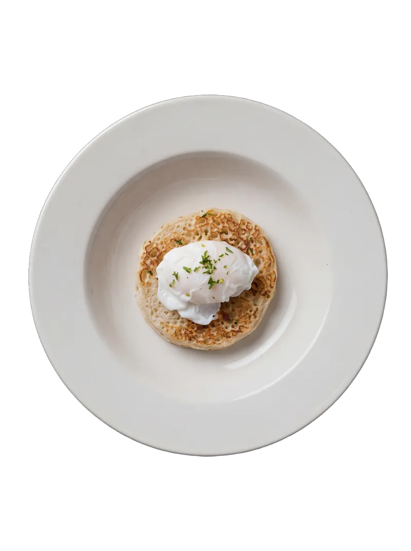 Eggs Benedict — poached eggs with hollandaise sauce on an English muffin