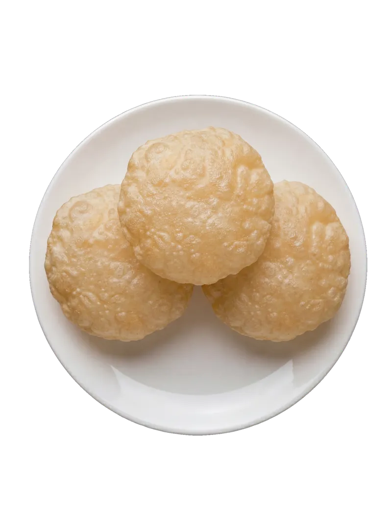 Three puffed deep-fried puris on a white plate